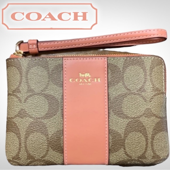 Coach Handbags - Coach Corner Zip Wristlet in Signature
Canvas Tan with Coral Stripe